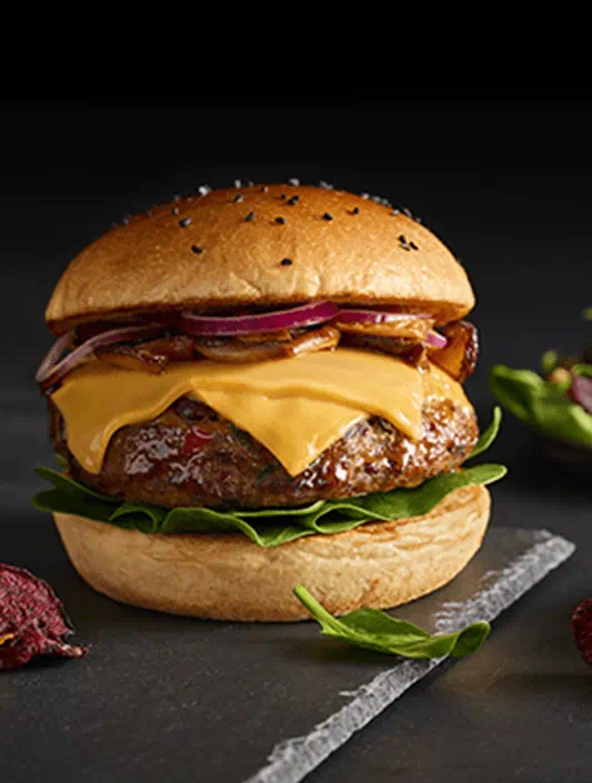 Plant-based burger served with Violife dairy-free cheese slices in a bun