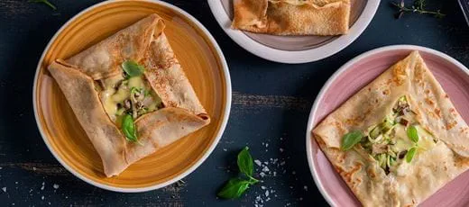 Mushroom Zucchini Crepes with homemade crepe batter filled with dairy free cheese and onion folded in square shape.